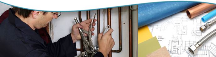 A man repairing a boiler pipe.